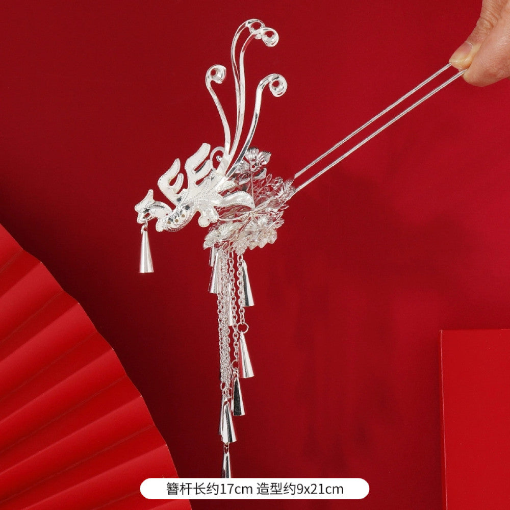 silver-tone hair stick featuring intricate openwork details and layered tassel fringe