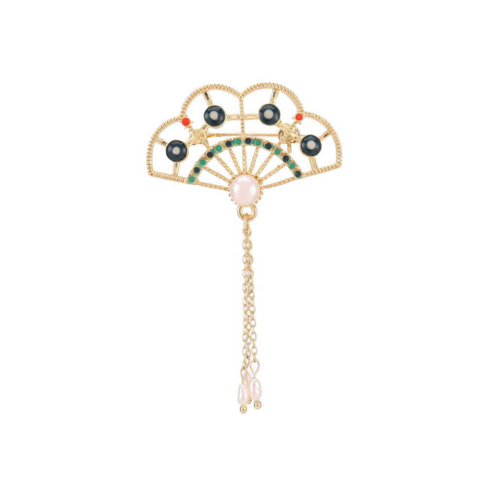 This elegant brooch features a delicate fan-shaped design, crafted with a gold-tone metal frame and adorned with vibrant multicolored gemstones. A lustrous pearl anchors the center, from which three graceful gold chains dangle, each finished with a small pearl drop. Perfect for adding a touch of sophistication to blazers, scarves, or special occasion outfits, this piece blends intricate craftsmanship with timeless, eye-catching charm 08