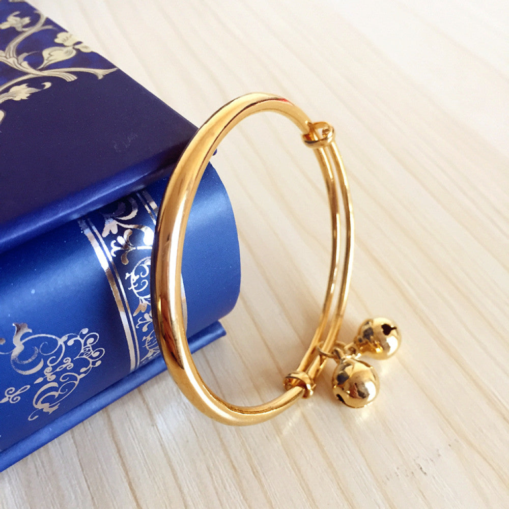 Fashion luxury engraved gold bangle, styled on a decorative black surface, ideal for elegant fashion enthusiasts in the US 02