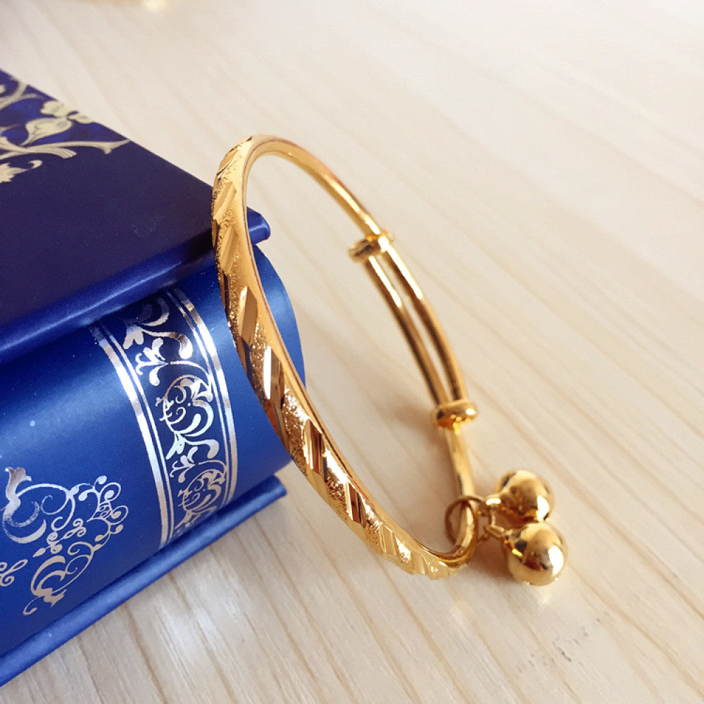 Fashion luxury engraved gold bangle, styled on a decorative black surface, ideal for elegant fashion enthusiasts in the US 04