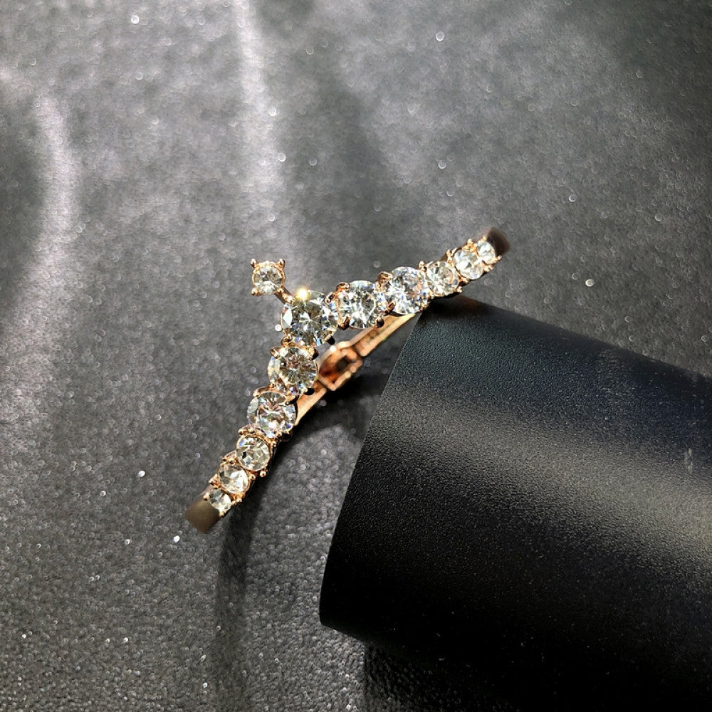 Fashion luxury rose gold bangle with heart-shaped diamond and intricate designs, displayed on black surface, ideal for luxury fashion and special occasion enthusiasts 07