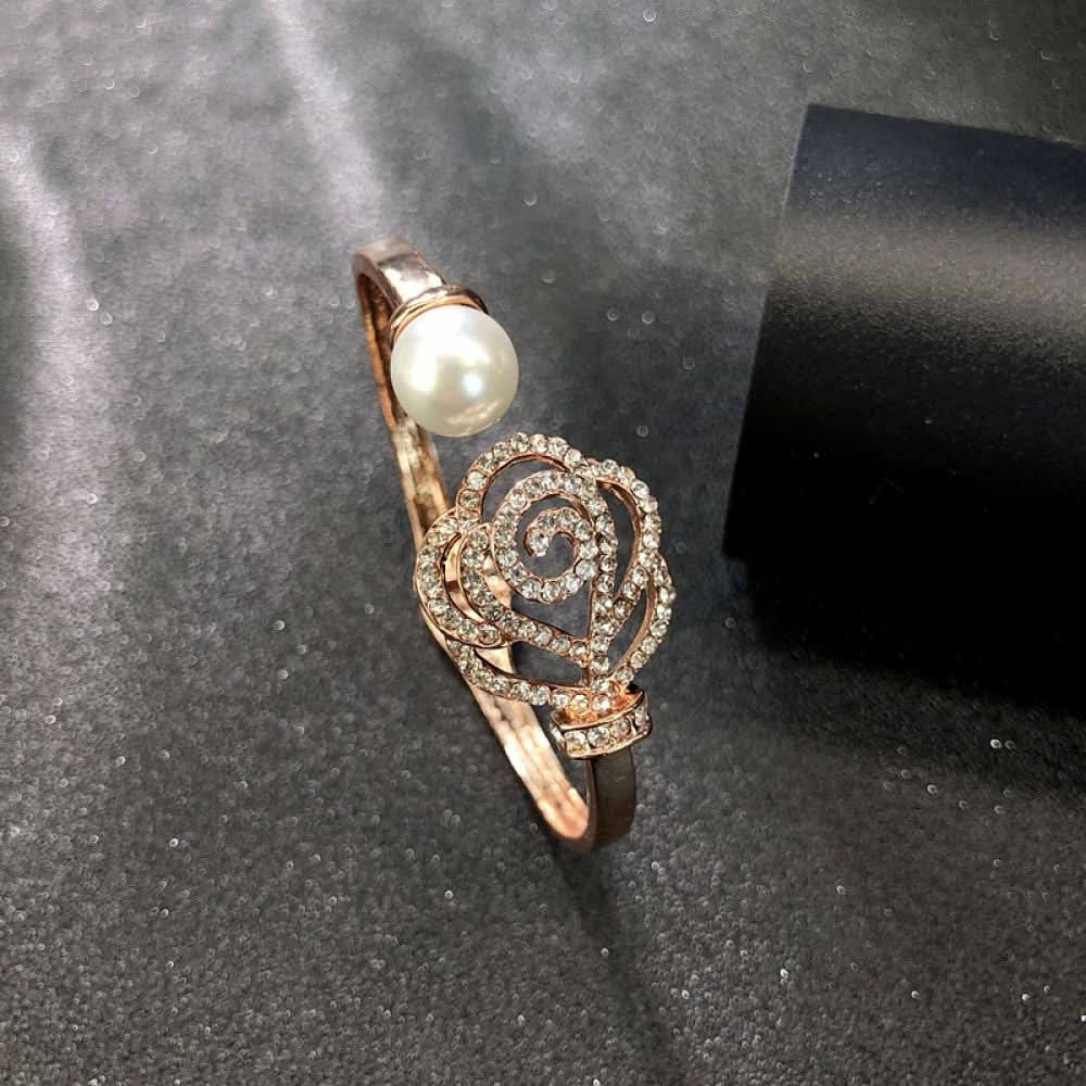 Fashion luxury rose gold bangle with heart-shaped diamond and intricate designs, displayed on black surface, ideal for luxury fashion and special occasion enthusiasts 08