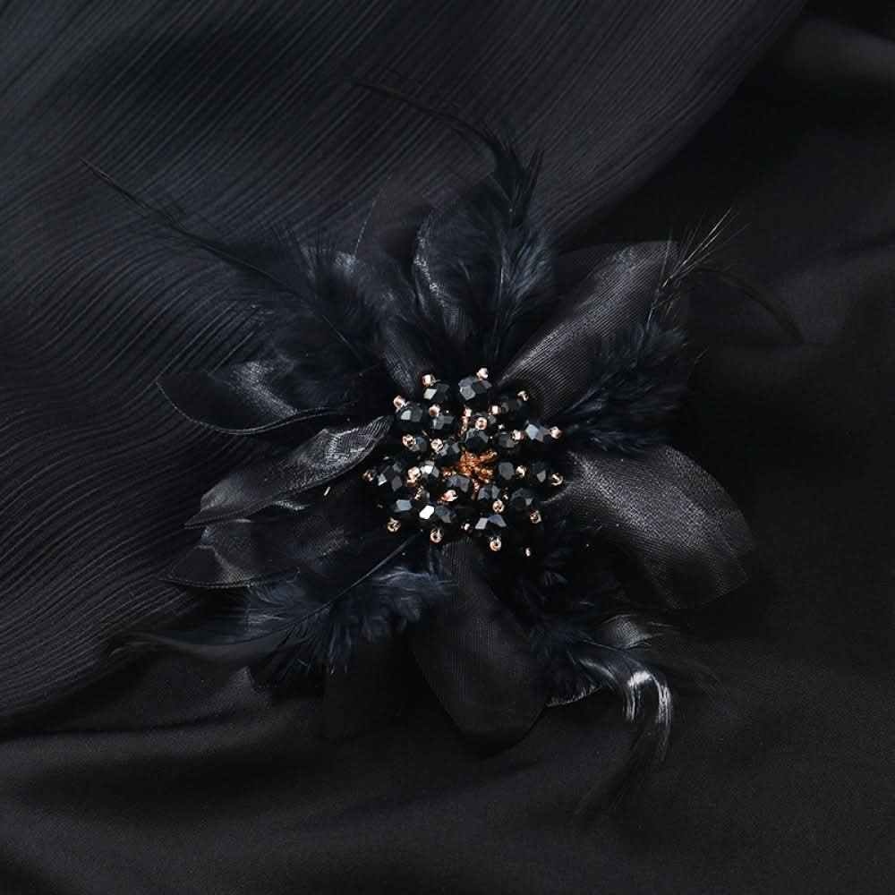 This hair accessory features light white feathers and sheer tulle, layered like a blooming flower. The center is adorned with sparkling crystals and pearls, creating a dreamy, ethereal look perfect for bridal styles or special occasions. 05