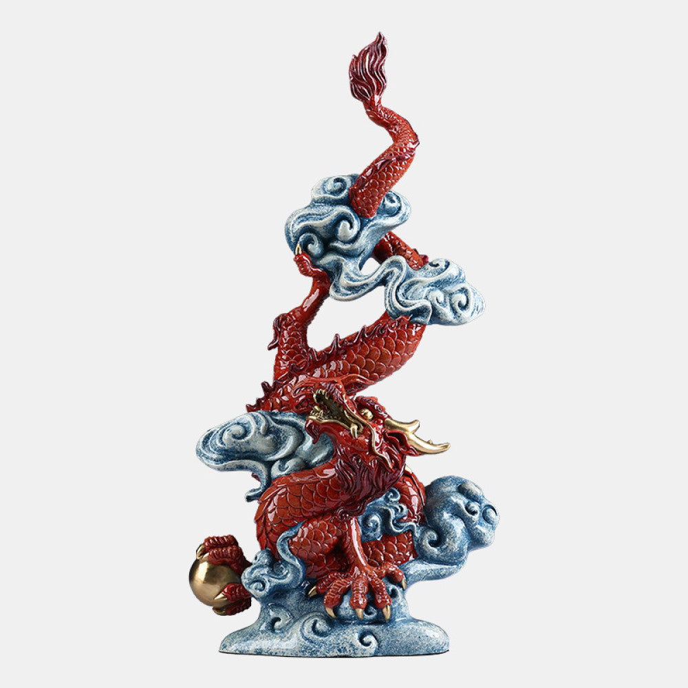 Intricate red Chinese dragon statue with gold accents, coiled around clouds and holding a treasure, a Feng Shui symbol of good luck and strength, displayed against a dark blue background 02