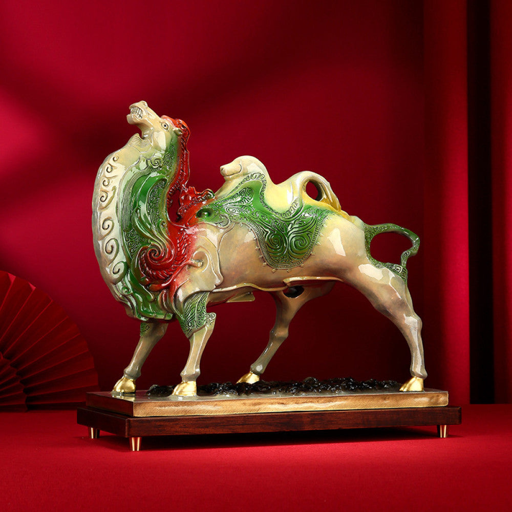 Colorful camel statue with intricate details, symbolizing good fortune in feng shui, placed on a wooden base against a vibrant red background with traditional Chinese fan decor 01
