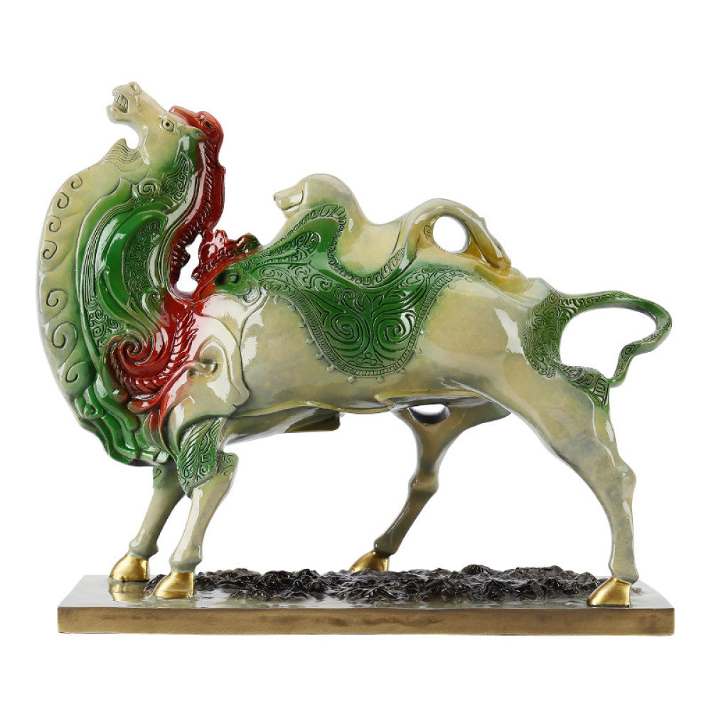Colorful camel statue with intricate details, symbolizing good fortune in feng shui, placed on a wooden base against a vibrant red background with traditional Chinese fan decor 02