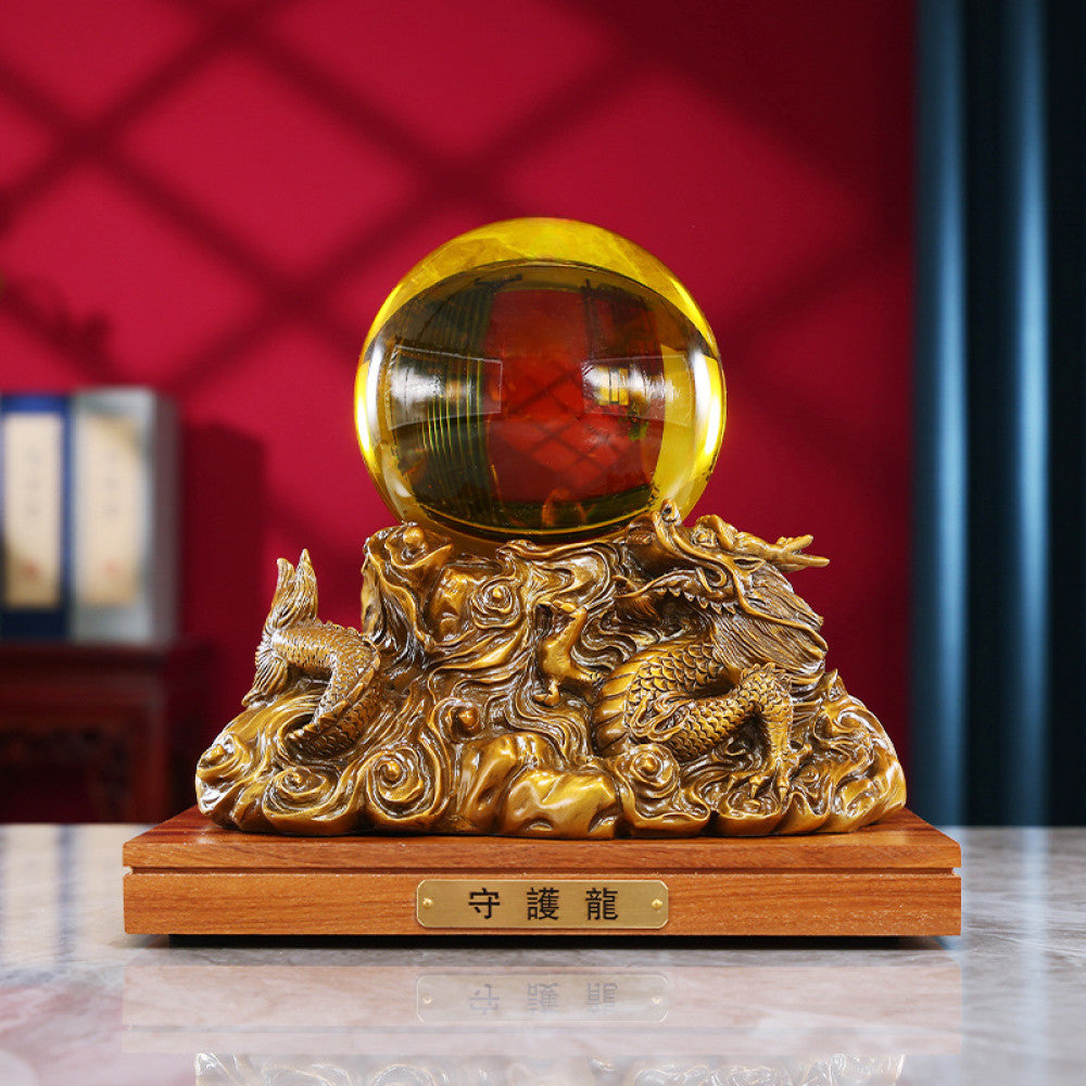 Golden dragon crystal ball statue with intricate carvings, a Feng Shui symbol of good fortune, displayed as elegant home decor on a wooden base against a red background 01