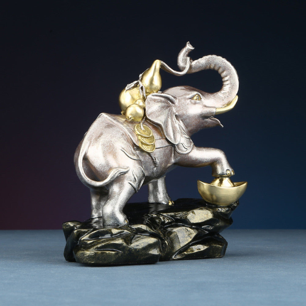 Feng Shui elephant statue with gourd and golden ingot, a symbol of prosperity and good luck, positioned on a rocky base against a white background 01