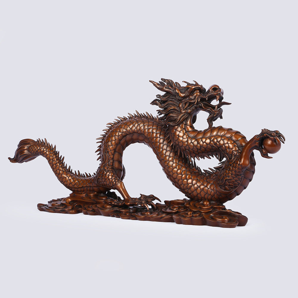 Bronze Chinese dragon statue with intricate scale details, a Feng Shui symbol of good fortune and strength, displayed as elegant home decor against a light background 08
