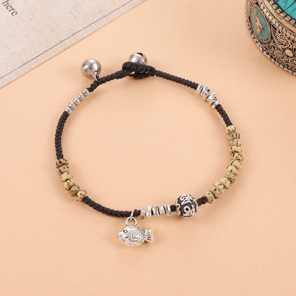 Gold beads with silver round tag, warm and luxurious.