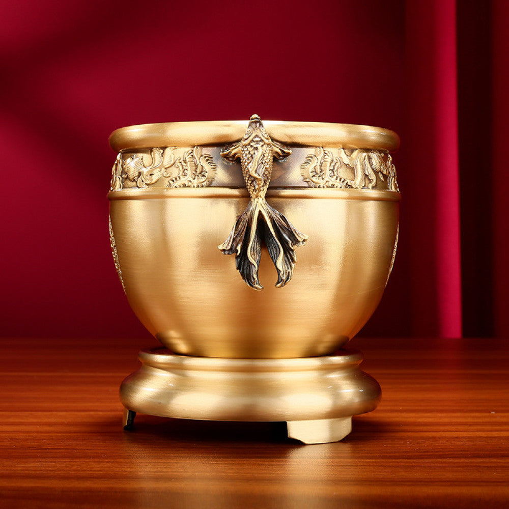 Polished golden bronze Chinese incense burner with fish-shaped handles, intricate lotus and fish carvings, and “Wealth & Prosperity” motif, a Feng Shui symbol of good fortune, displayed as elegant home decor against a white background 02