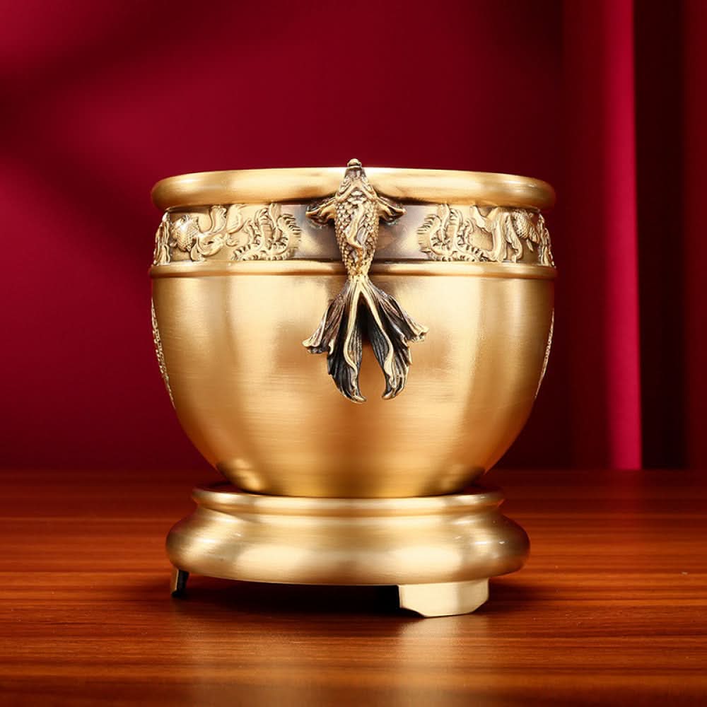 Polished golden bronze Chinese incense burner with fish-shaped handles, intricate lotus and fish carvings, and “Wealth & Prosperity” motif, a Feng Shui symbol of good fortune, displayed as elegant home decor against a white background 02