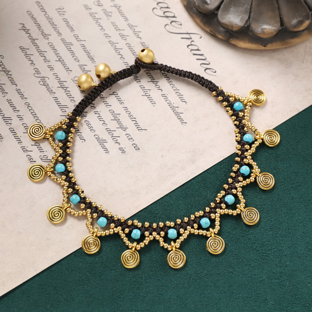 Gold tassel charms with turquoise beads, playful and summery.