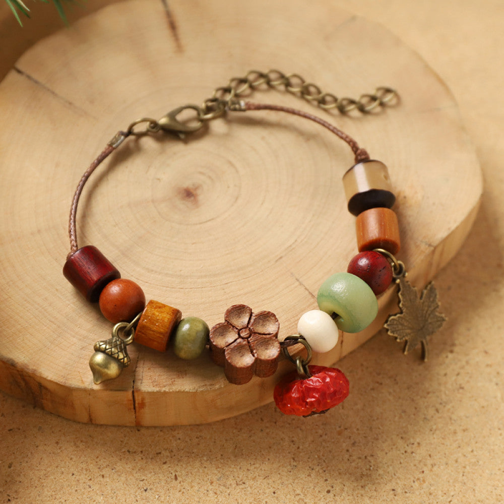 Green beads with a small wood tag, light and refreshing.