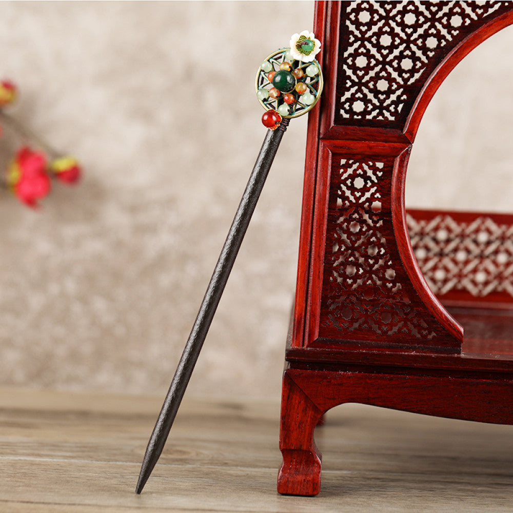 Boho vintage ethnic hair stick featuring a dark wooden-look handle, topped with light green flower, red bead