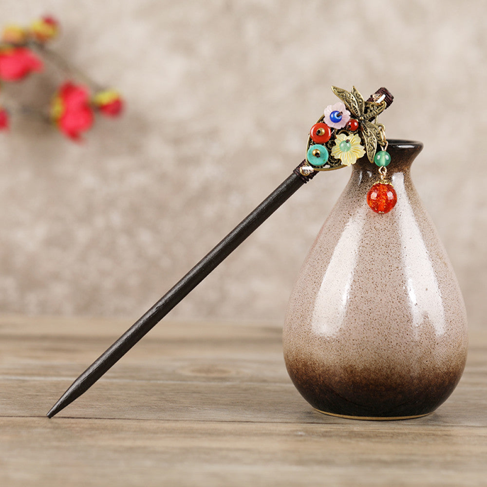 Boho vintage ethnic hair stick featuring a dark wooden-look handle, topped with light green flower, red bead 02