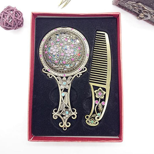 A single handcrafted wooden comb with ornate metal details placed inside a gift box