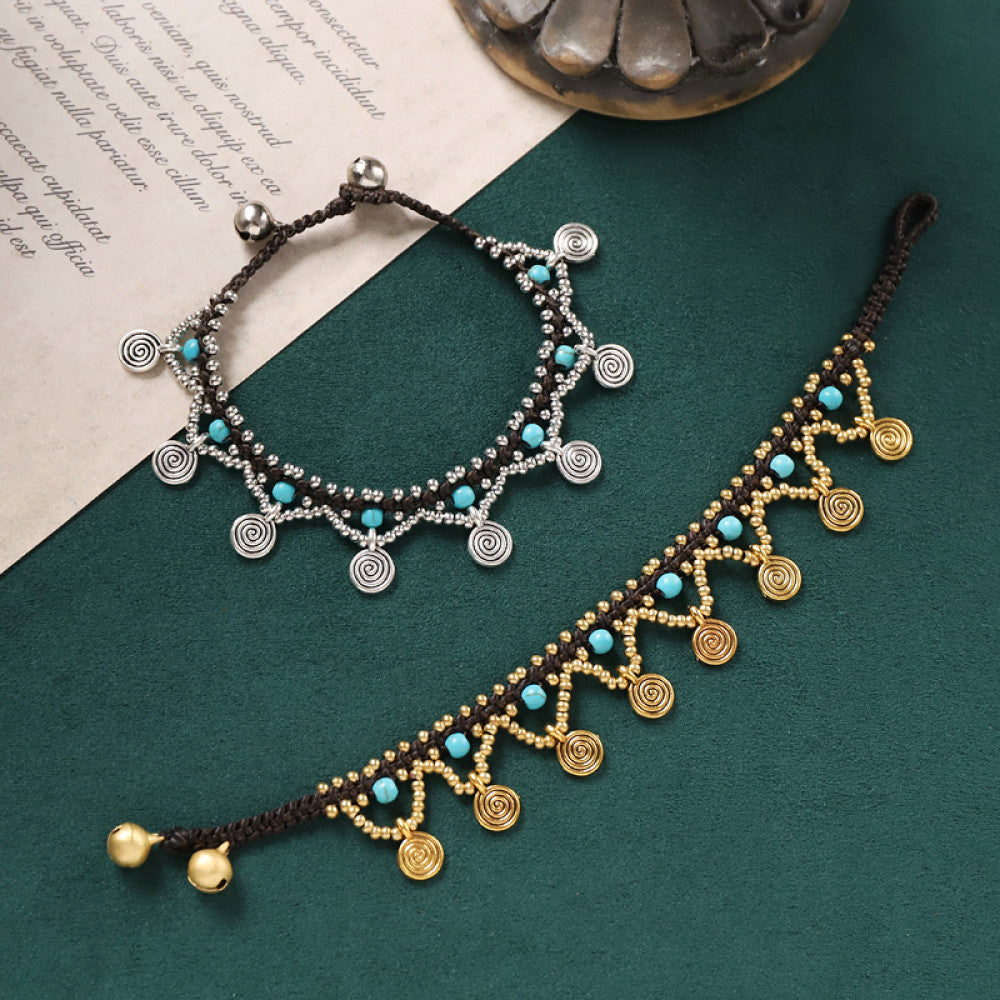 Two-piece set of silver and gold coin anklets, perfect for stacking.