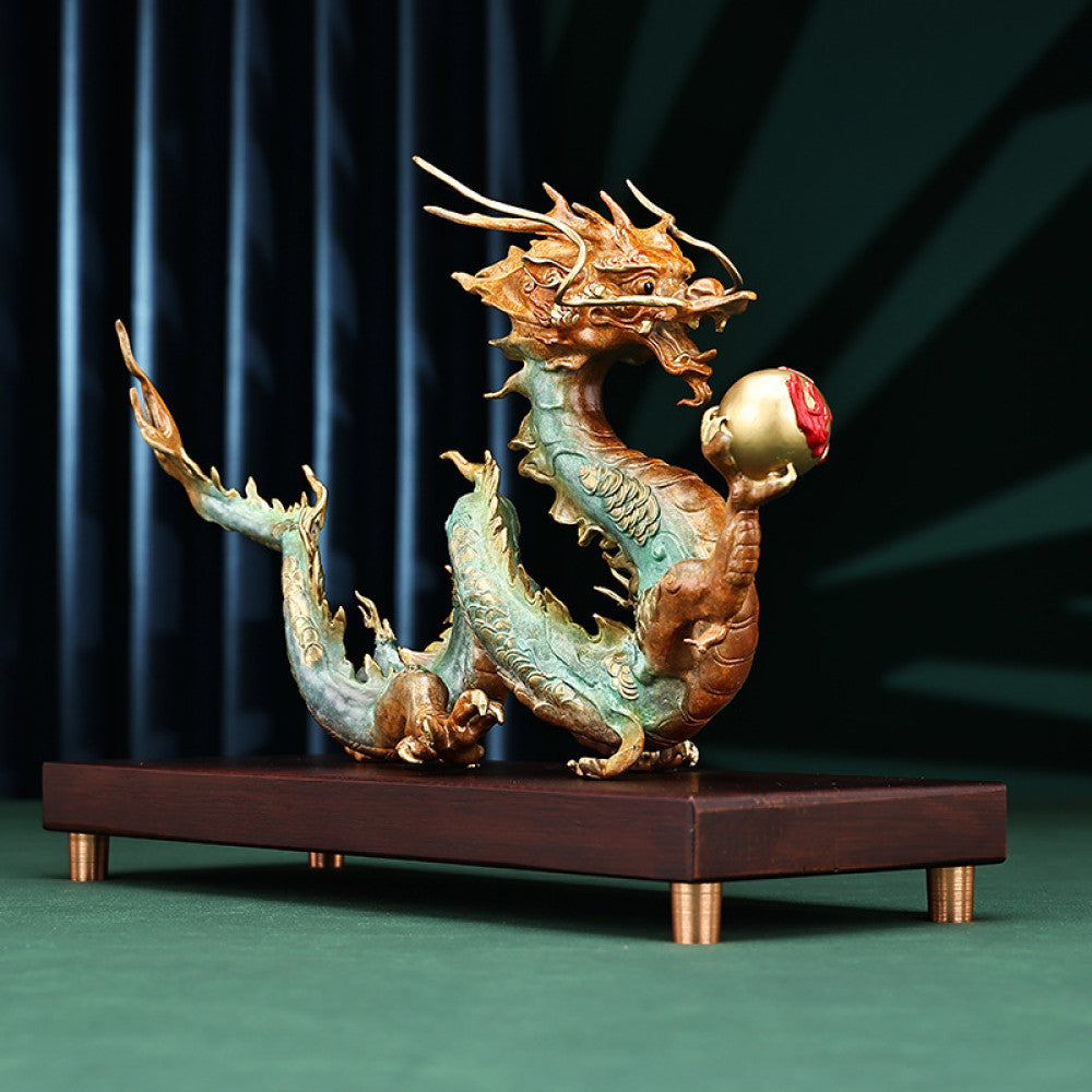Colorful Chinese dragon statue with a red pearl, a Feng Shui symbol of good fortune and strength, displayed on a wooden base as elegant home decor against a dark background 04
