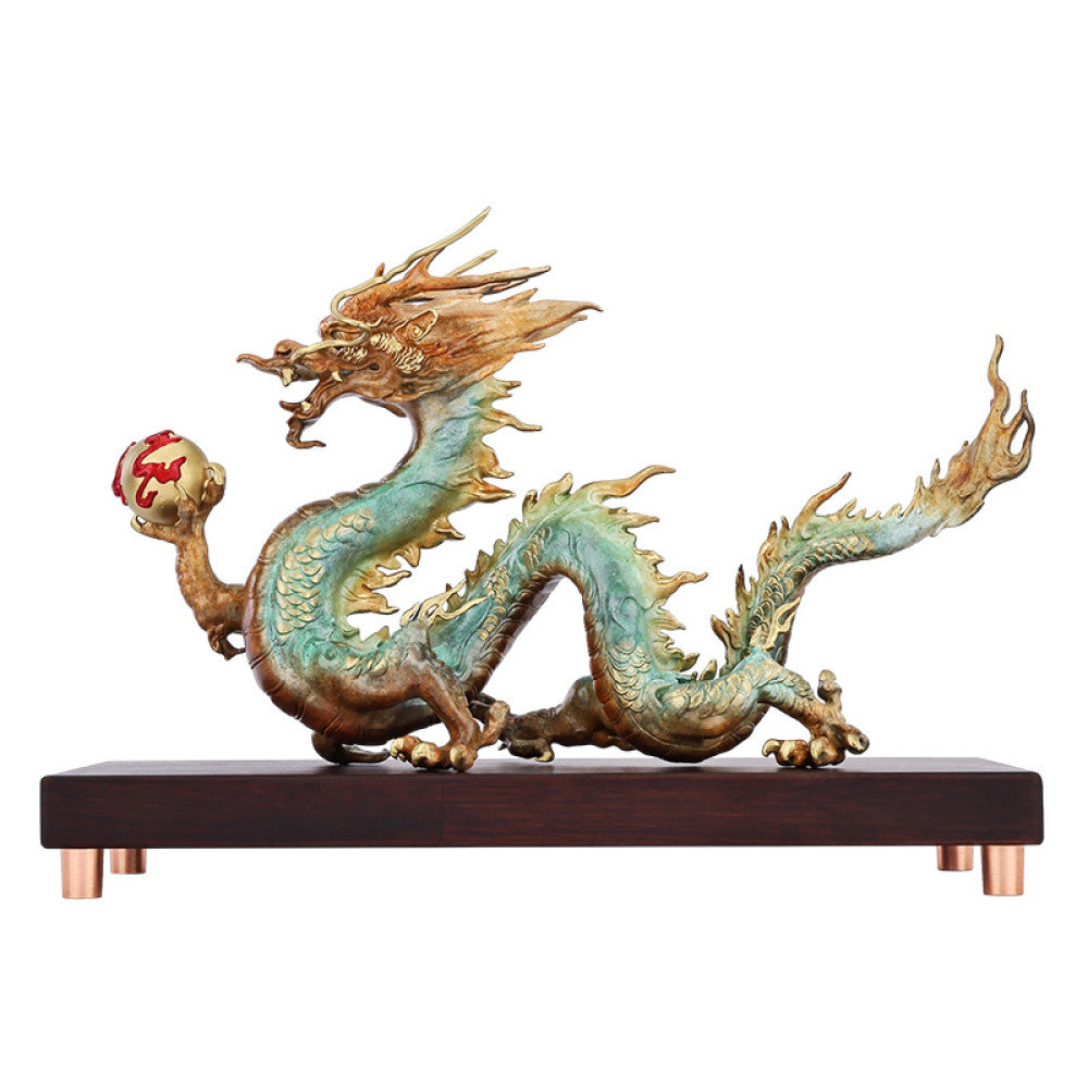 Colorful Chinese dragon statue with a red pearl, a Feng Shui symbol of good fortune and strength, displayed on a wooden base as elegant home decor against a dark background 05
