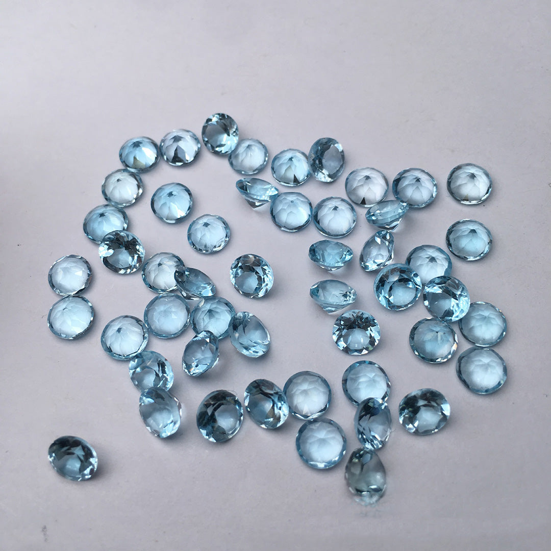 Aquamarine on a light gray background, in a variety of cuts, offers a jewel-quality finish.