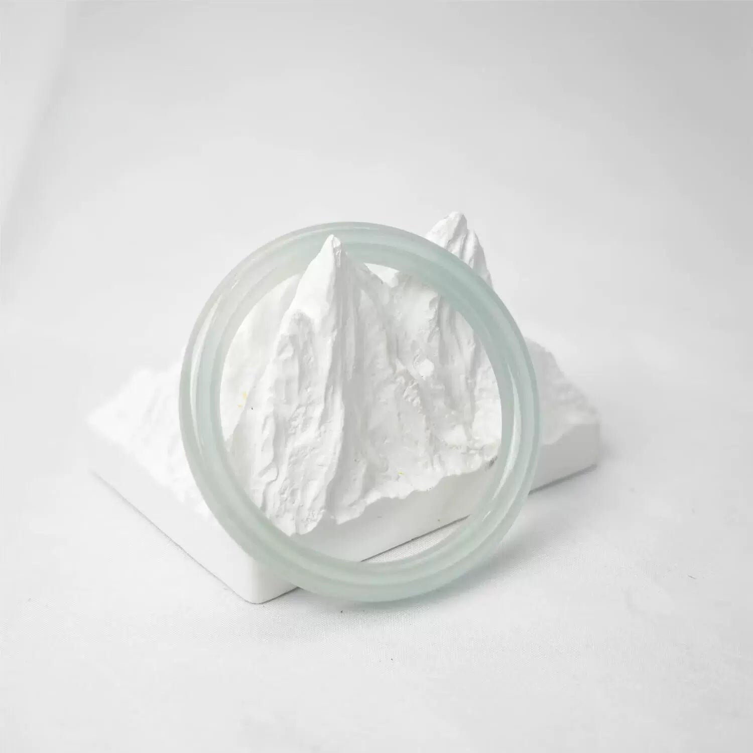 Translucent green icy jade bangle on white mountain decor