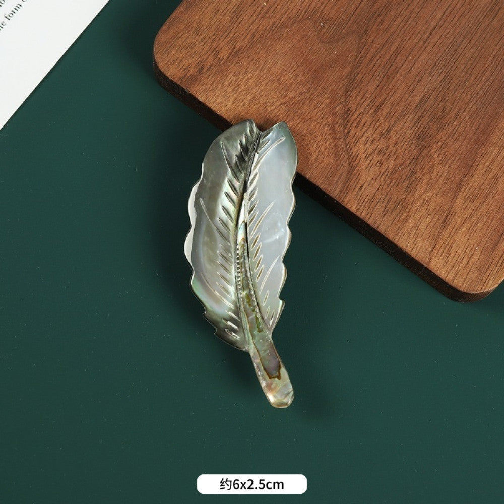 This elegant butterfly brooch is handcrafted from natural mother-of-pearl and iridescent abalone shell, showcasing unique organic patterns. A perfect nature-inspired accessory to elevate any outfit 03