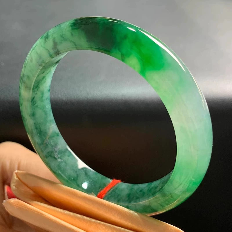 Handheld Natural Vivid Green Flower Jade Bangle Bracelet on Display Pad - Luxury Jade Jewelry 02