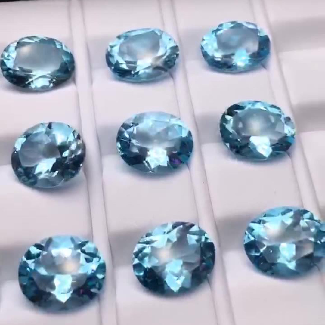 Nine exquisitely cut light blue oval aquamarines, high-quality rough stones for jewelry setting.