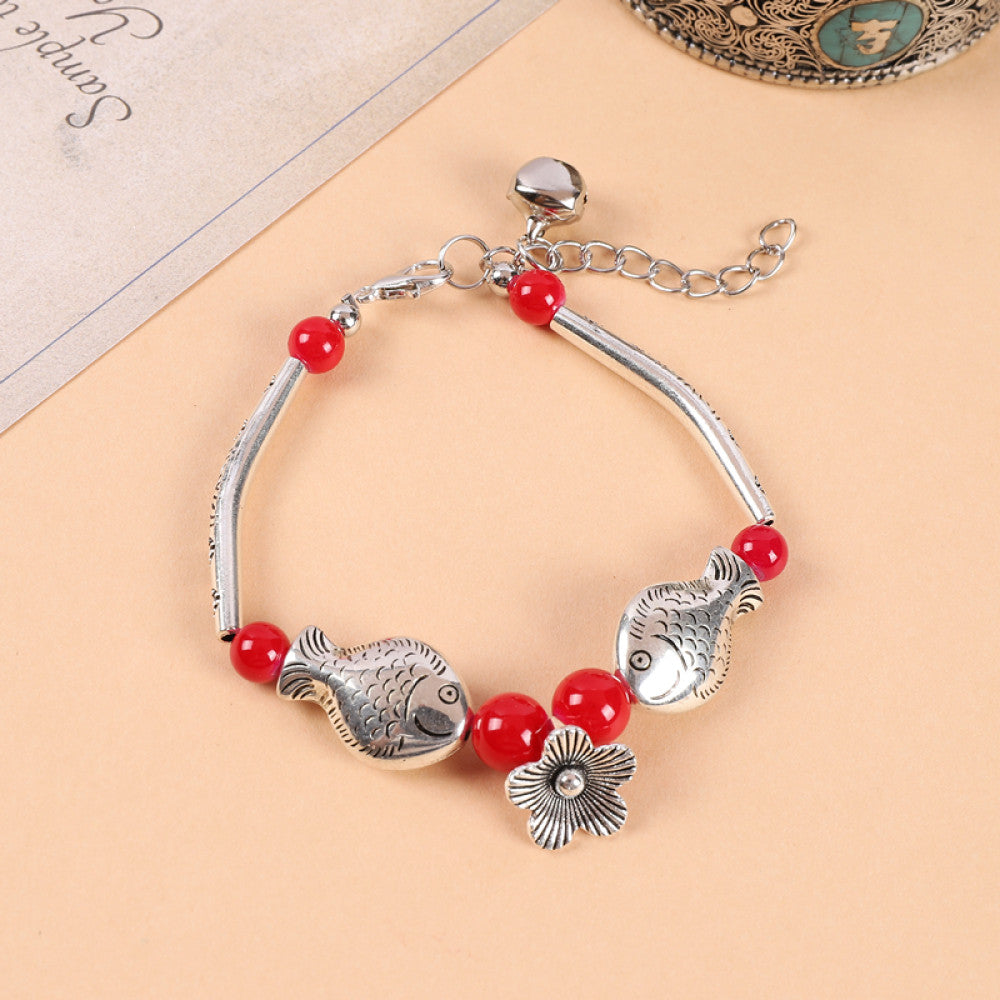 Red beads with small silver pendant, delicate and charming.