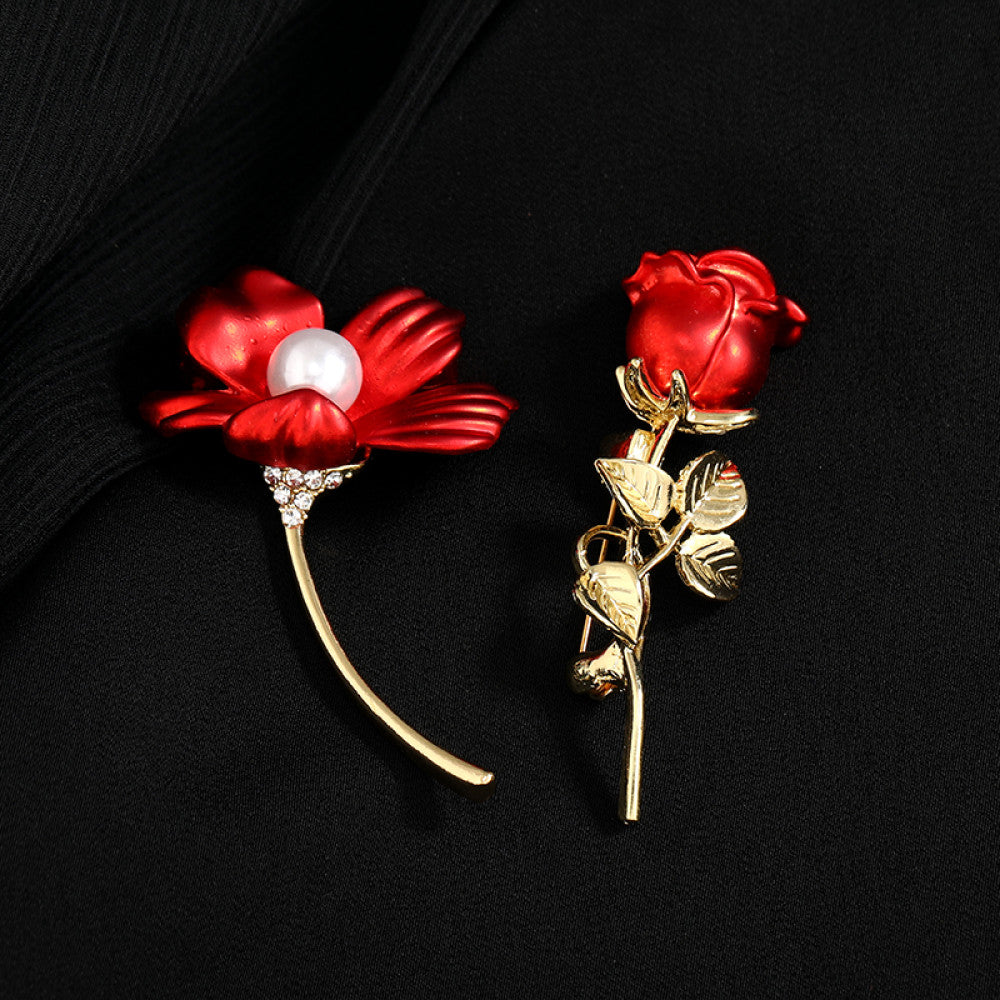 This elegant brooch features vibrant red petals with a lustrous pearl center, set on a gold stem with sparkling crystal accents. A romantic, eye-catching accessory 05