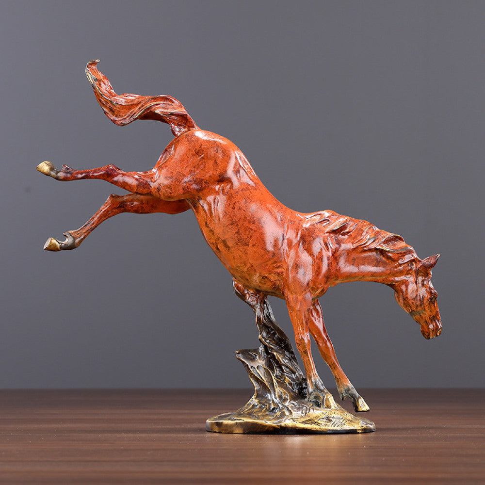 Red galloping horse statue with intricate details, a Feng Shui symbol of success and strength, displayed as elegant home decor on a wooden table against a gray background 02