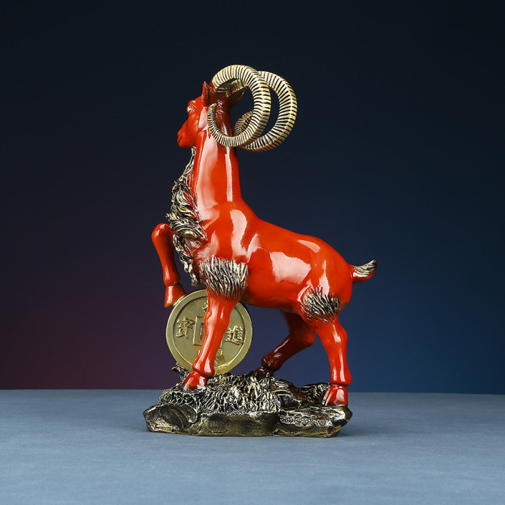 Red goat statue with golden coin detail, a Feng Shui symbol of wealth and good fortune, displayed as elegant home decor against a dark background 01