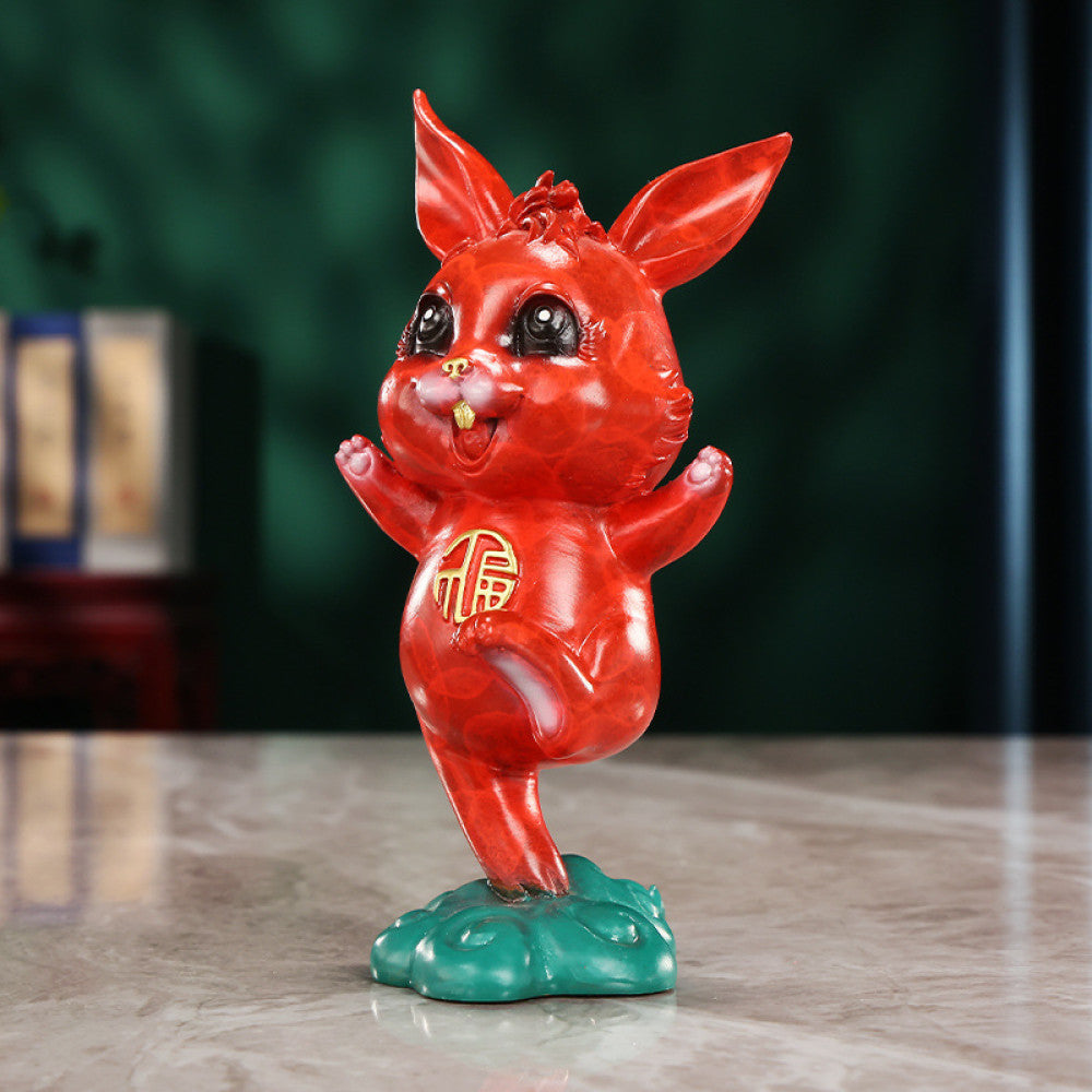 Cute red rabbit statue with golden fortune symbol, a Feng Shui symbol of good fortune, displayed as charming home decor on a marble table against a dark background 01