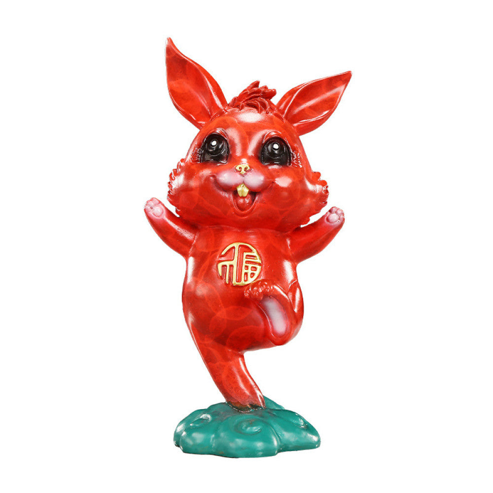 Cute red rabbit statue with golden fortune symbol, a Feng Shui symbol of good fortune, displayed as charming home decor on a marble table against a dark background 02