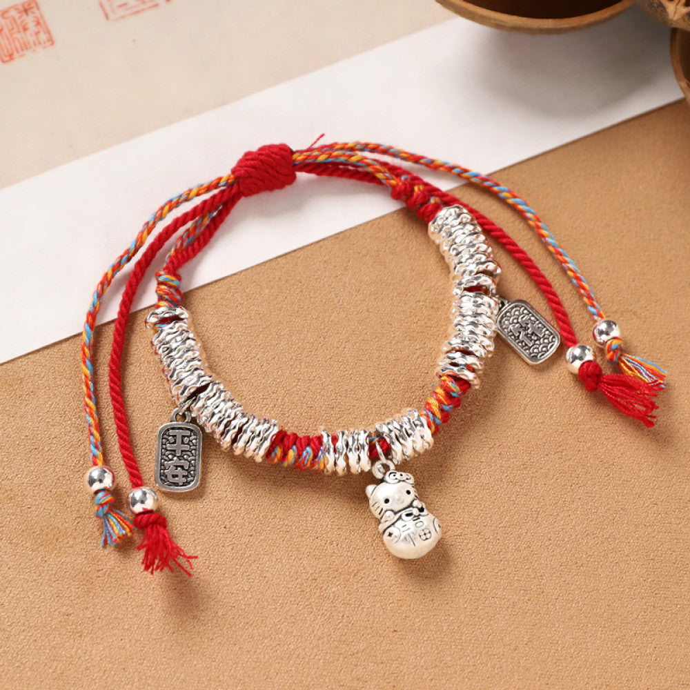 Red cord with round silver pendants, soft and elegant for daily wear.