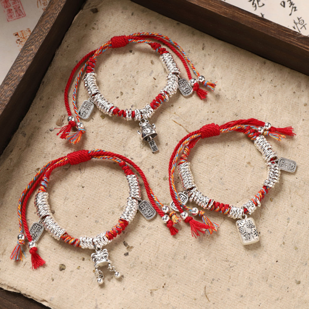 Three matching red-silver bracelets, perfect for stacking or gifting.