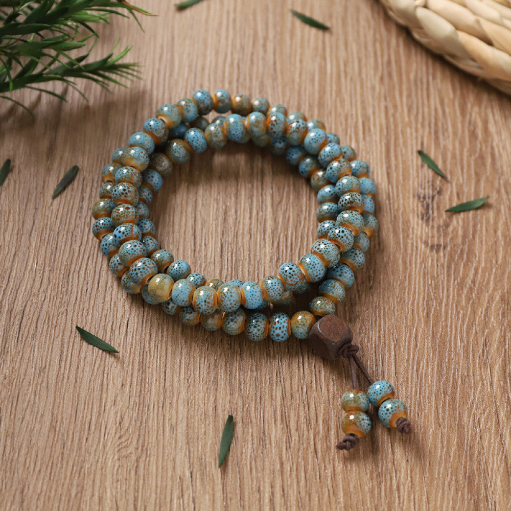 Teal glazed beads, tranquil and serene, with small turquoise tassel.