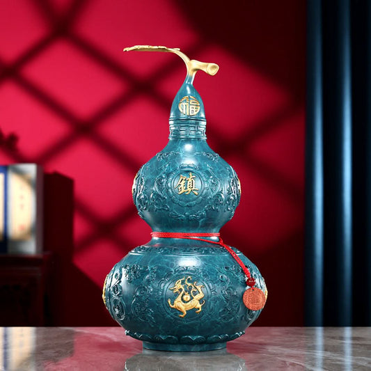Blue-green brass gourd feng shui decor with golden dragon, "Fu" (fortune) characters, and red string, isolated on white background 01