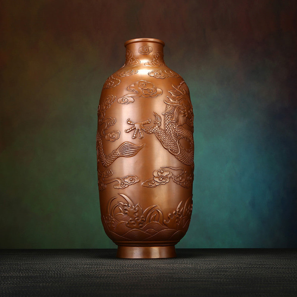 Pair of traditional Chinese bronze vases with intricate dragon carvings against a textured dark background 01