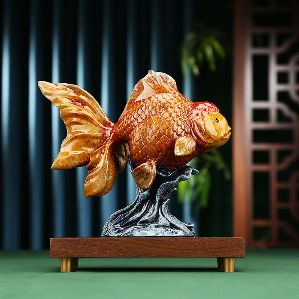 Colorful traditional Chinese goldfish statue with detailed scales, placed on a wooden base with a rocky stand, against a dark blue curtain and Chinese lattice background 01