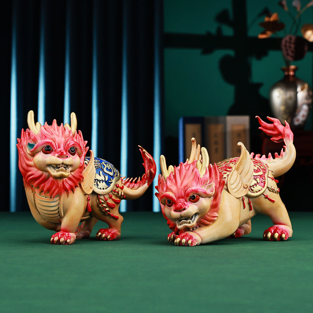 Pair of colorful traditional Chinese Qilin statues with red and blue - golden details, placed against a red background with Chinese fan decoration 01