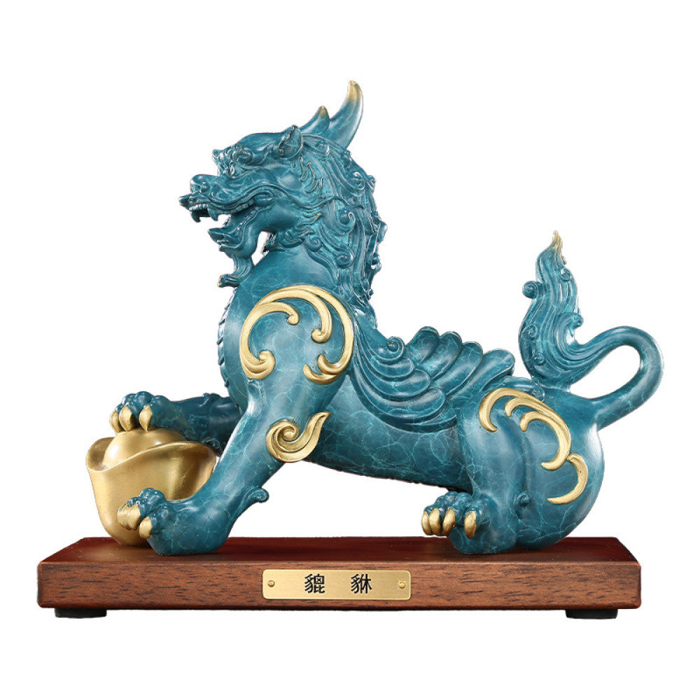 Traditional Chinese Feng Shui Pi Xiu statue in blue-green with gold inlay, holding a gold ingot, placed on a wooden base against a red background 02