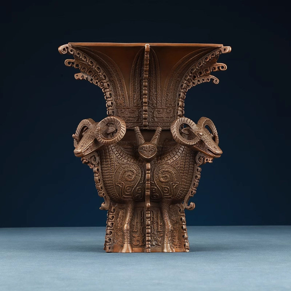 Traditional Chinese four - sheep bronze zun vessel with intricate carvings, isolated on white background 01