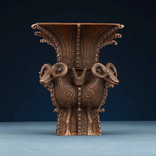 Traditional Chinese four - sheep bronze zun vessel with intricate carvings, isolated on white background 01
