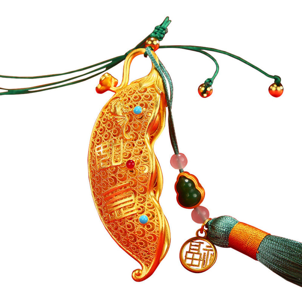 Traditional Chinese gold - plated bean pod pendant with lucky characters, gem inlays, and tassel (featuring "Fu" symbol), isolated on white background