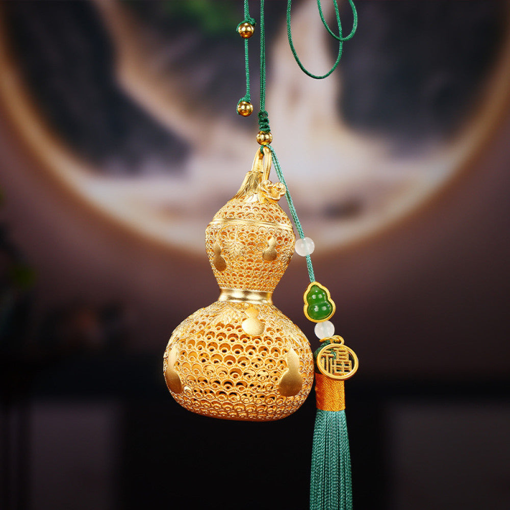 Traditional Chinese golden gourd hanging ornament with intricate openwork, tassel, and jade accents, set against a red background with Chinese lattice design 02