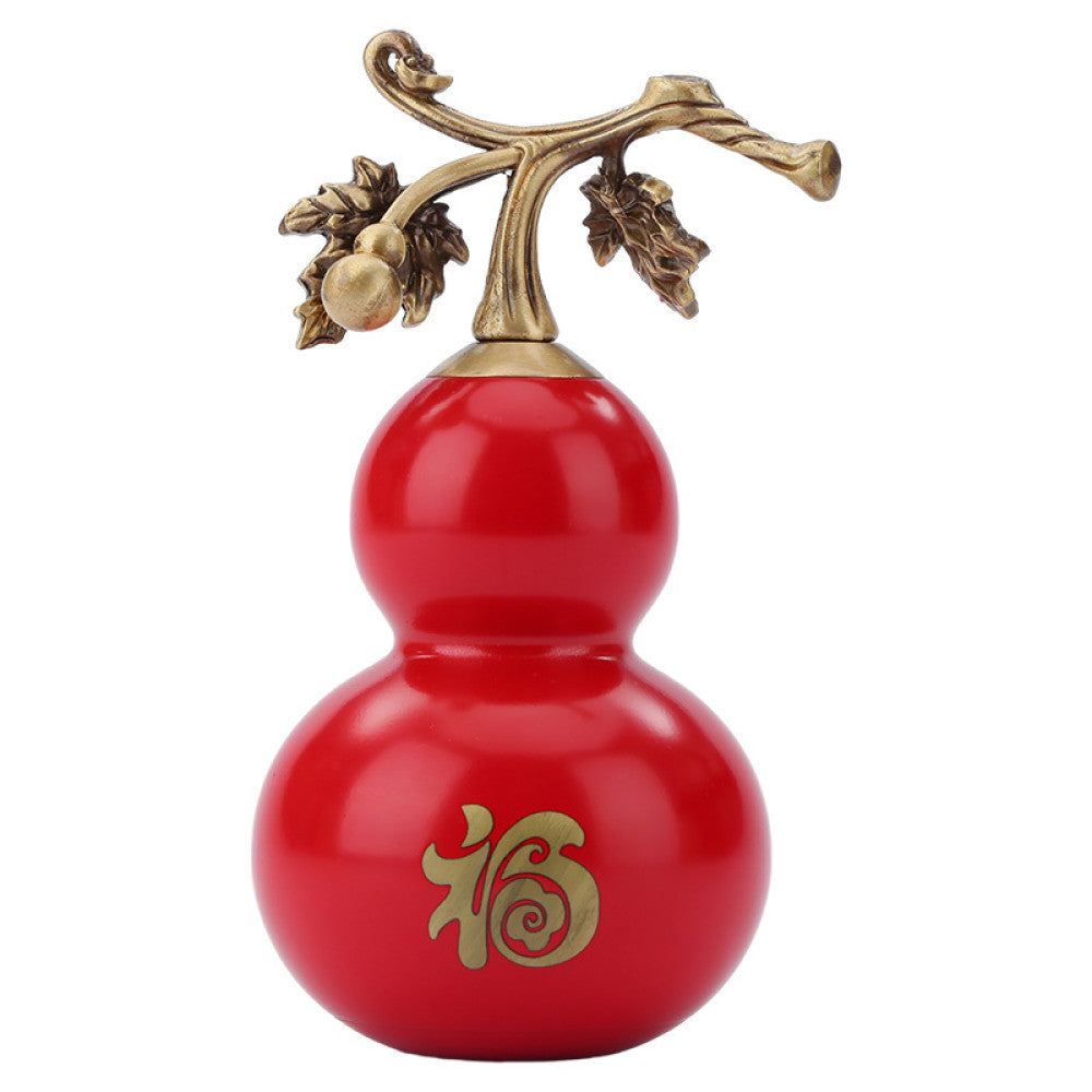 Traditional Chinese red gourd ornament with golden "Fu" character and vine details, placed on a teal surface with a red fan and lattice window in the background 02