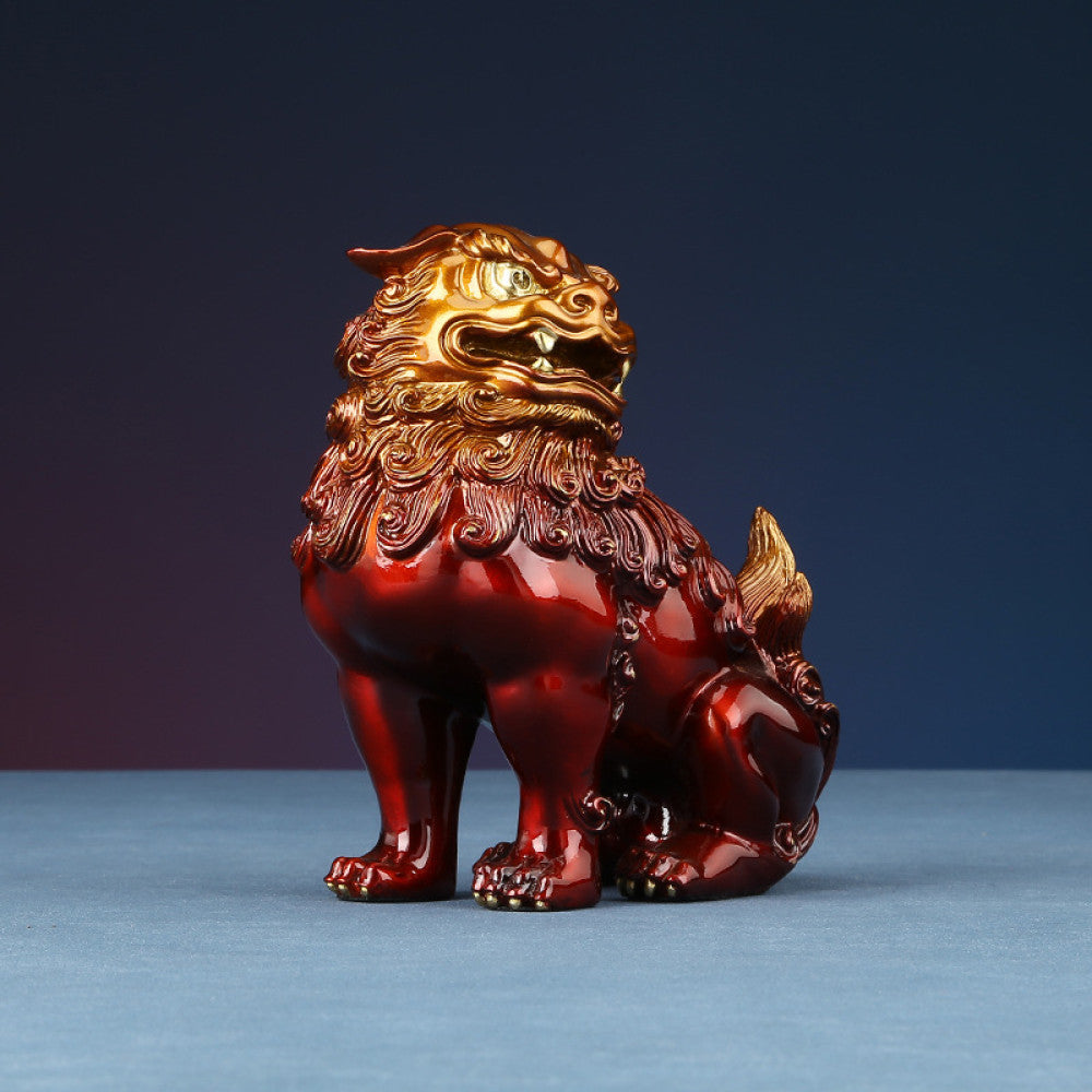 Traditional Chinese red and gold Foo Dog statue with intricate details, set against a dark blue gradient background