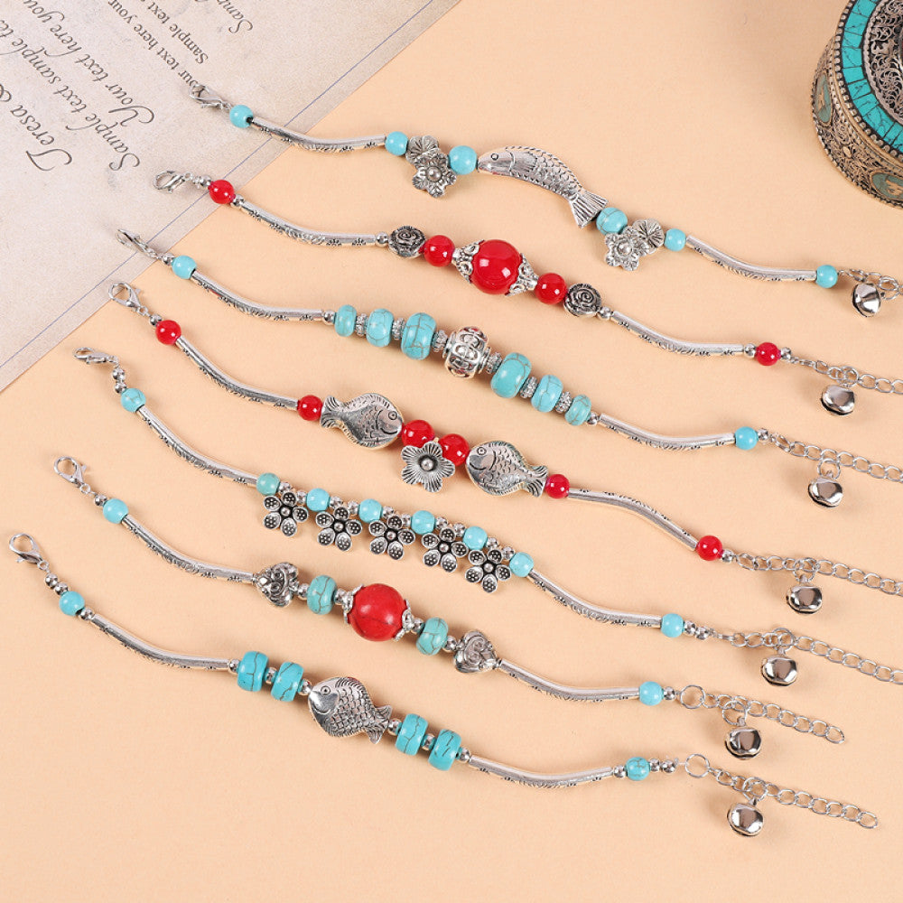 Multiple matching turquoise bracelets, perfect for layering.